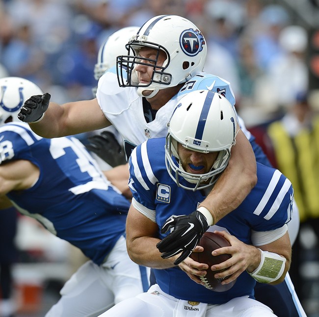 Indianapolis Colts quarterback Andrew Luck is hit by Tennessee Titans defensive end Karl Klug in the first half of an NFL football game Sunday Sept. 27 2015 in Nashville Tenn