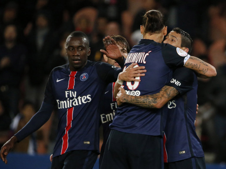 Paris Saint-Germain's Zlatan Ibrahimovic is congratulated by team-mates