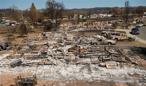 Destroyed homes and vehicles scorched by the Valley fire line Jefferson St. in Middletown Calif on Monday Sept. 21 2015. According to fire officials the blaze ranks as the sixth worst wildfire in California history after destroying more than 1,000