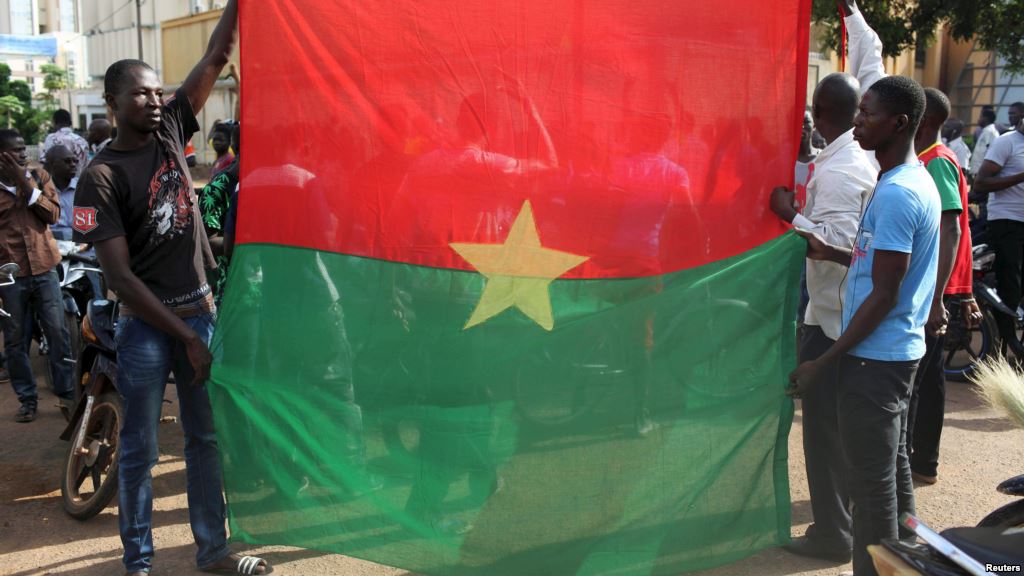 Anti-coup protesters hold a Burkina Faso flag in Ouagadougou Burkina Faso