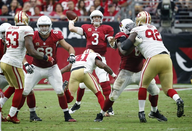 Arizona Cardinals quarterback Carson Palmer throws against the San Francisco 49ers during the second half of an NFL football game Sunday Sept. 27 2015 in Glendale Ariz