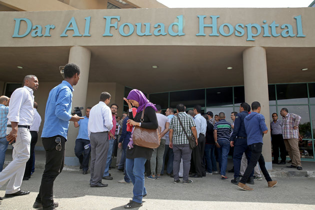 Egyptian journalists wait for information about tourists who were injured Sunday while on a desert safari trip in front of the Dar Al Fouad Hospital in Cairo Egypt Monday