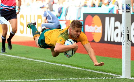 Australia's Drew Mitchell scores a try during the Rugby World Cup match at Villa Park