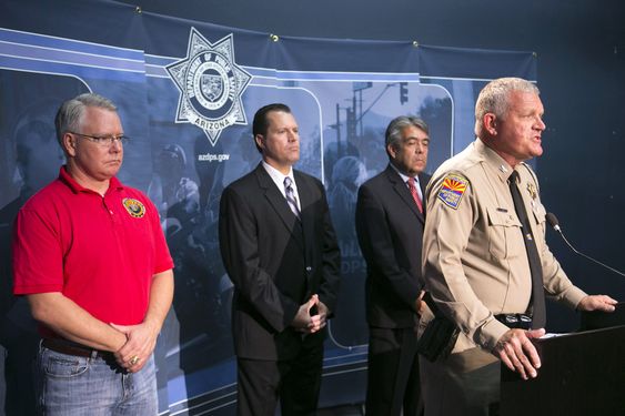 Director of Department of Public Safety speaks during a press conference to announce the arrest of a suspect in the Phoenix freeway shootings at DPS headquarters in Phoenix on Friday Sept.18 2015. He is flanked from left