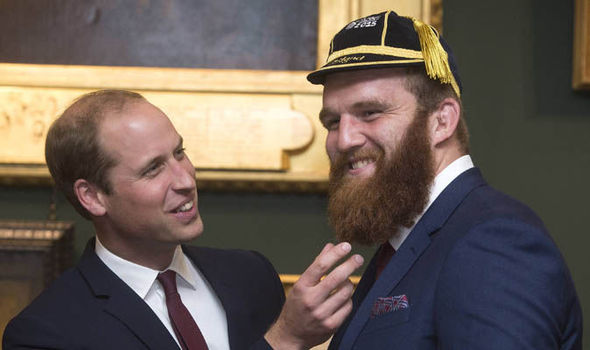 Prince William joking with Wales rugby player Jake