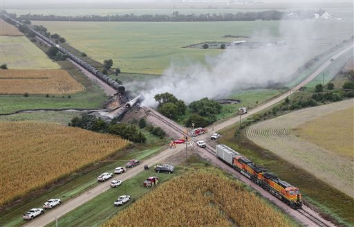 Smoke rises from a burning ethanol tanker car Saturday Sept. 19 2015 after the 98-car BNSF train carrying ethanol derailed in a rural part of Bon Homme County awash in corn fields between the towns of Scotland and Lesterville S.D. Three tankers were