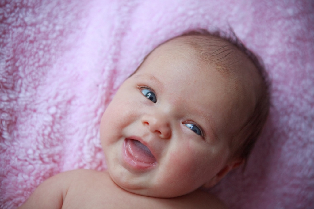 Babies smiles may have a hidden purpose