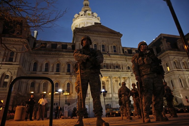 Members of the National Guard stand guard at Baltimore City Hall