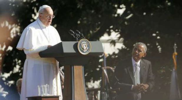 Barack Obama at the left hand of Pope Francis