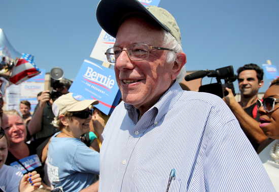 U.S. Democratic presidential candidate and U.S. Senator Bernie Sanders pauses to talk to the media before the start of the Milford Labor Day Parade in Milford New Hampshire