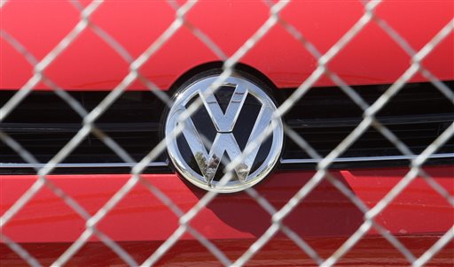 A Volkswagen diesel sits behind a security fence on a storage lot near a VW dealership Wednesday Sept. 23 2015 in Salt Lake City. Volkswagen CEO Martin Winterkorn resigned Wednesday days after admitting that the world's top-selling carmaker had