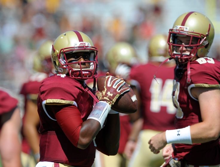 Boston College quarterback Darius Wade is taken down by Florida State defensive back Lamarcus Brutus during the first half of an NCAA college football game in Boston Friday Sept. 18 2015