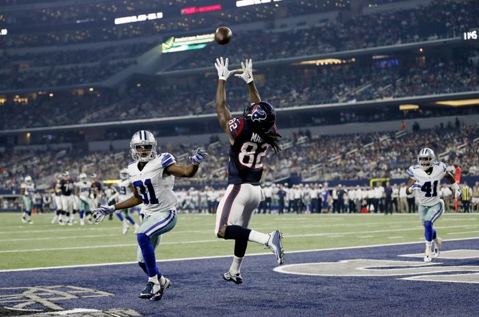 Houston Texans wide receiver Keshawn Martin makes a touchdown reception over Dallas Cowboys cornerback Byron Jones during the second half of a preseason NFL football game Thursday Sept. 3 2015 in Arlington Texas