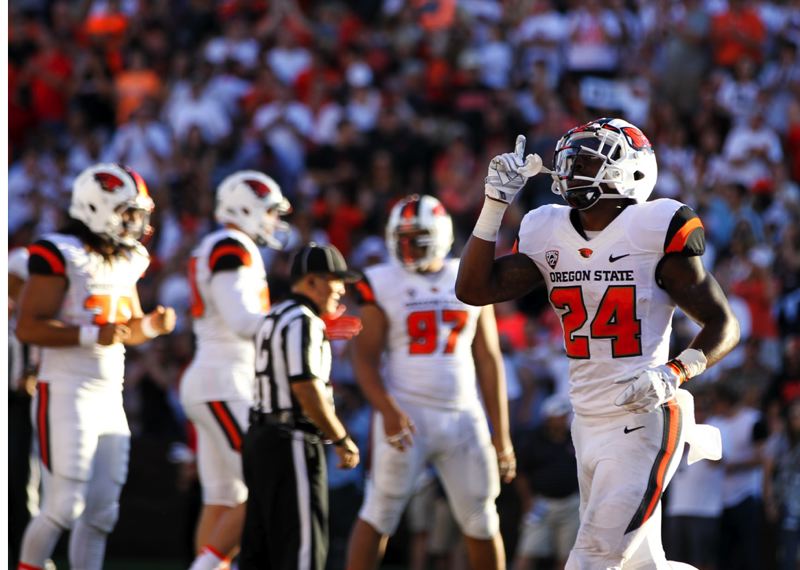 Oregon State running back Storm Barrs Woods scores a touchdown as the Beavers defeat San Jose State at Reser Stadium