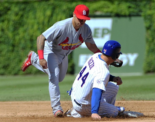 Chicago Cubs Anthony Rizzo is tagged out on a steal attempt by St. Louis Cardinals second baseman Kolten Wong left during the fifth inning of a baseball game Saturday Sept. 19 2015 in Chicago