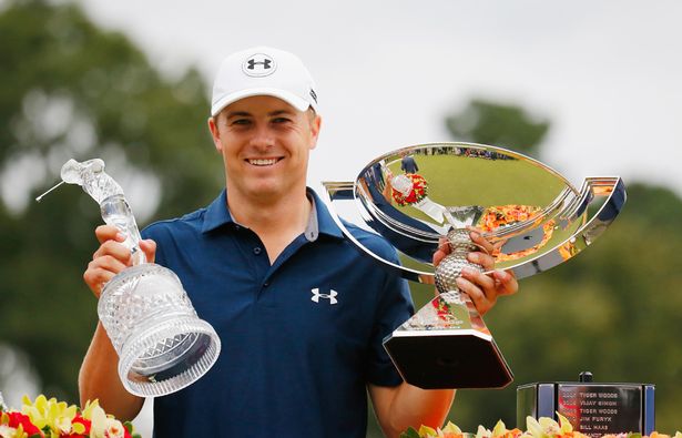 Jordan Spieth of the United States poses on the 18th green after winning both the TOUR Championship By Coca Cola and the FedExCup at East Lake Golf Club