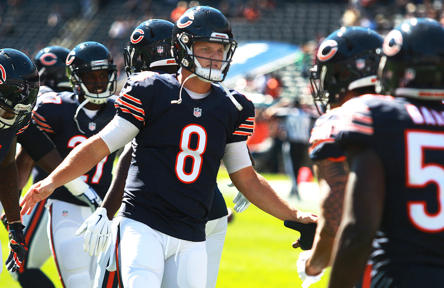 Chicago Bear quarterback Jimmy Clausen greets temmates during pre-game introductions on Sunday