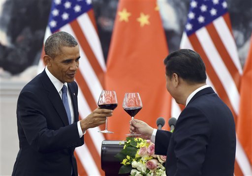 President Barack Obama toasts with Chinese President Xi Jinping at a lunch banquet in the Great Hall of the People in Beijing. There could be some awkward undercurrents when the Chinese president is honored with