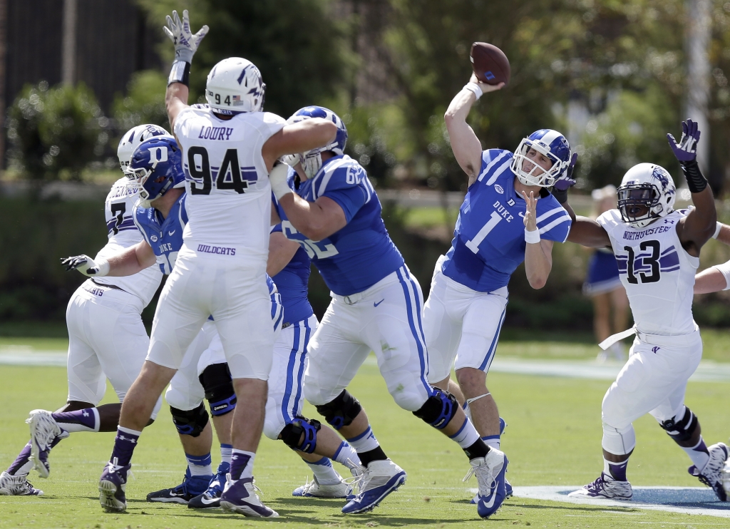 Duke quarterback Thomas Sirk had trouble throwing the ball all day over Northwestern's 6-foot-6 DE Dean Lowry