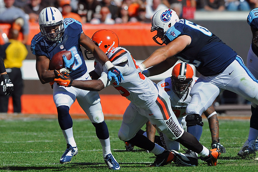 Tennessee Titans running back Bishop Sankey runs the ball as Cleveland Browns middle linebacker Karlos Dansby makes the tackle during the second half at First Energy Stadium. The Browns won 28-14