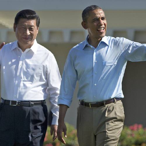 Chinese President Xi Jinping left and U.S. President Barack Obama walk at the Annenberg Retreat of the Sunnylands estate in Rancho Mirage Calif. As Obama meets Xi in Washington this week the world’s