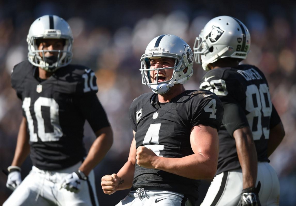 Derek Carr #4 of the Oakland Raiders celebrates the game winning touchdown in the fourth quarter