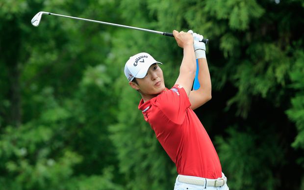Danny Lee of New Zealand hits his tee shot on the second hole during the final round of the Tour Championship at East Lake Golf Club