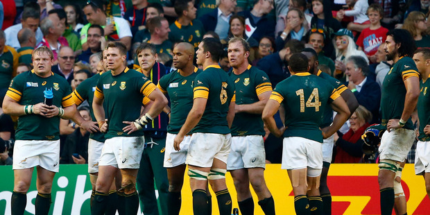 Dejected South Africa players are stunned following their defeat