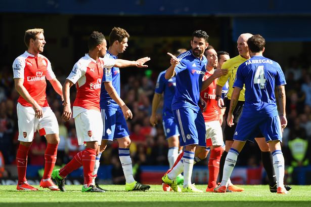 Diego Costa of Chelsea speaks to referee Mike Dean