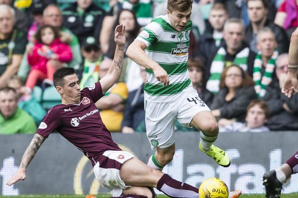 James Forrest is tackled by Jamie Walker of Heart’s