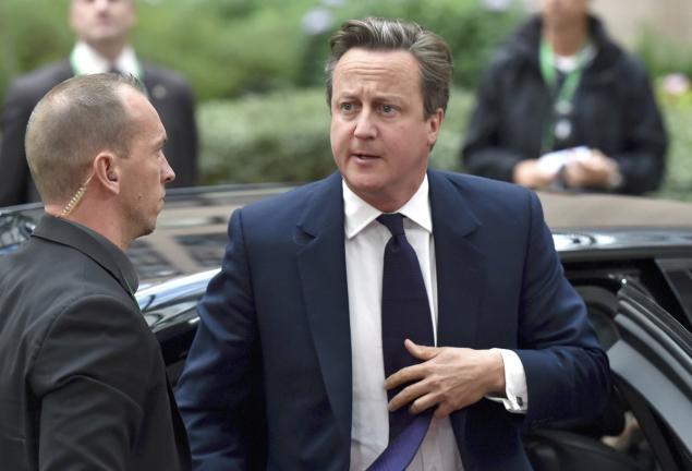 British Prime Minister David Cameron arrives at an extraordinary summit on the migrant crisis in Brussels Belgium on Wednesday