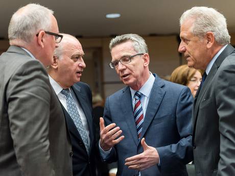 German Interior Minister Thomas de Maiziere 2nd right talks with European officials and ministers at the start of a meeting of EU justice and interior ministers at the EU Council building in Brussels on Tuesday