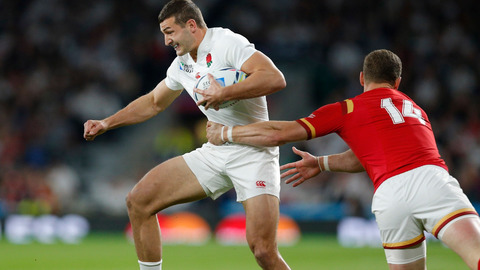 England's Jonny May left is tackled by Wales George North. AP