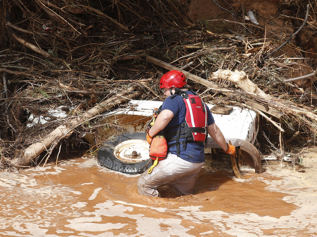 Floods kill 8, leave 5 missing in town known for sect leader