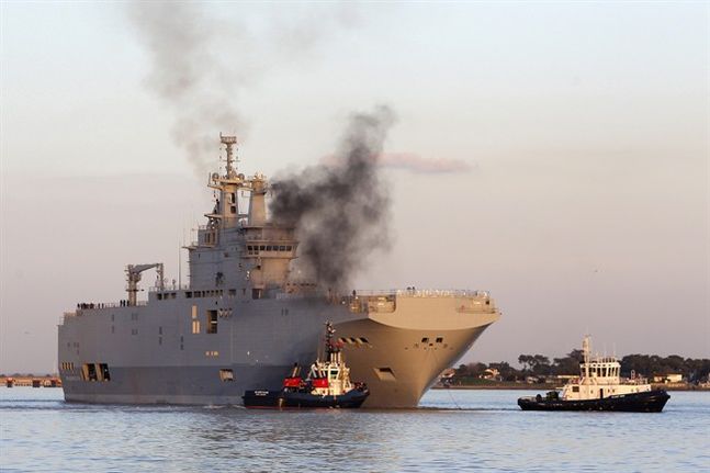 French-built warship BPC Vladivostock designed to strengthen Russia's ability to deploy troops tanks and helicopter gunships leaves the Saint Nazaire's harbor western France. France says Wednesday Sept.23 2015