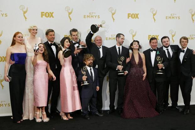 The cast of HBO’s fantasy epic show Game of Thrones poses backstage with their award for ‘Outstanding Drama Series’ during the 67th Primetime Emmy Awards in Los Angeles California on 20 September 2015. Reuters