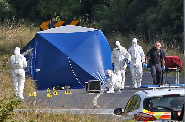 Gardai remove Mr Mulligan's body from the scene this afternoon