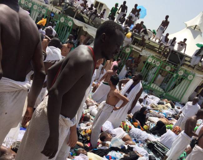 Muslim pilgrims gather around the victims of a stampede in Mina Saudi Arabia during the annual hajj pilgrimage on Thursday Sept. 24 2015. Hundreds were killed and injured Saudi authorities said. The crush happened in Mina a large valley about five