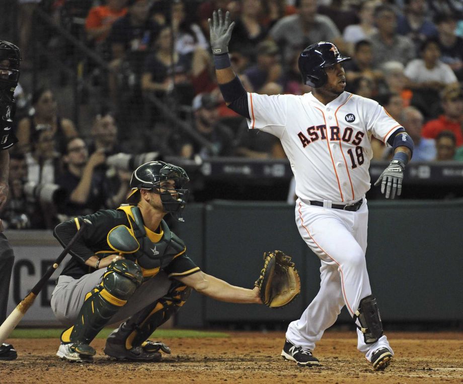 The Astros’ Luis Valbuena reacts after hitting an RBI single during the sixth inning Saturday. The Astros beat the Athletics 10-6