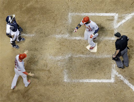 St. Louis Cardinals&#039 Jason Heyward is congratulated after hitting a two-run home run during the 10th inning of a baseball game against the Milwaukee Brewers Tuesday Sept. 15 2015 in Milwaukee