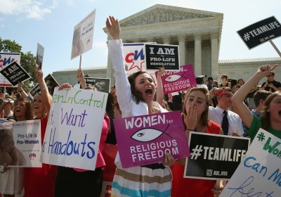 Hobby Lobby supporters react happily to the Supreme Court decision in Burwell v. Hobby Lobby