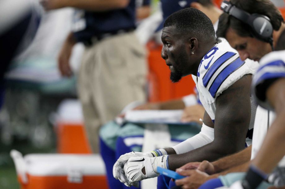 Dallas Cowboys wide receiver Dez Bryant sits on the bench during the first half of an NFL football game against the New York Giants Sunday Sept. 13 2015 in Arlington Texas