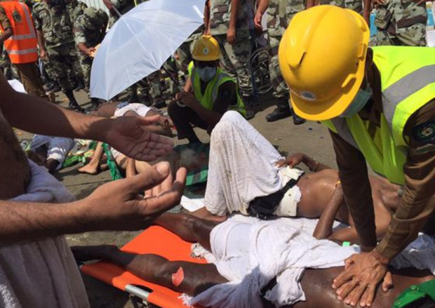 In this image posted on the official Twitter account of the directorate of the Saudi Civil Defense agency a pilgrim is treated by a medic after a stampede that killed and injured pilgrims in the holy city of Mina