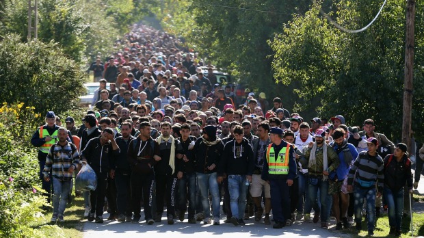 Hundreds of migrants walk into Austria from Hungary on Tuesday