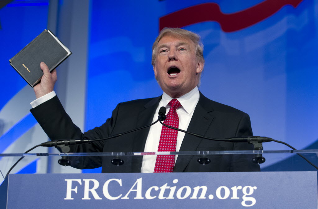 Donald Trump holds up a bible his mother gave him as a child as he speaks at the Values Voter Summit on Sept. 25 2015 in Washington