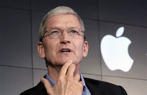 Apple CEO Tim Cook responds to a question during a news conference at IBM Watson headquarters in New York. Apple has announced plans for a new product event on Sept. 9 in San Francisco where the giant tech compa