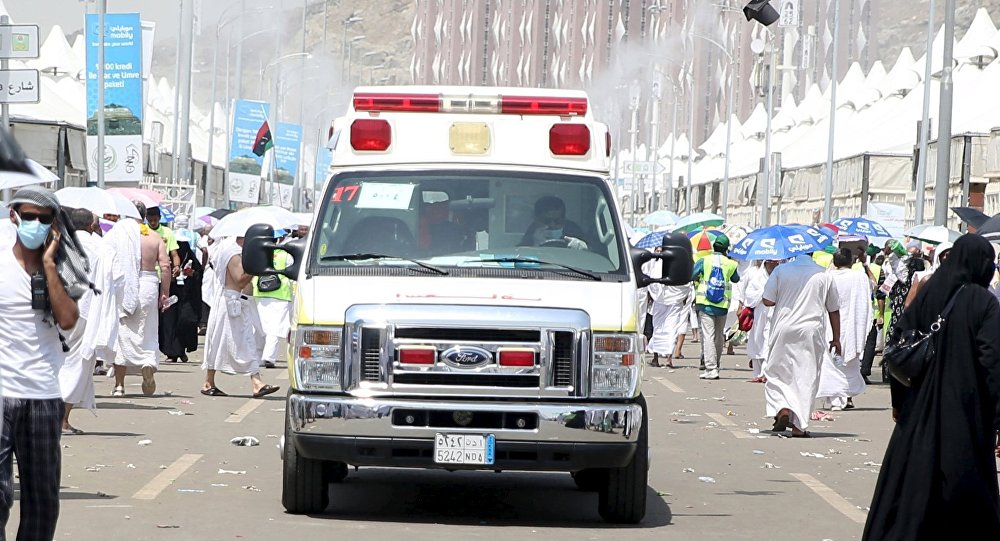 An ambulance evacuates victims following a crush caused by large numbers of people pushing at Mina outside the Muslim holy city of Mecca