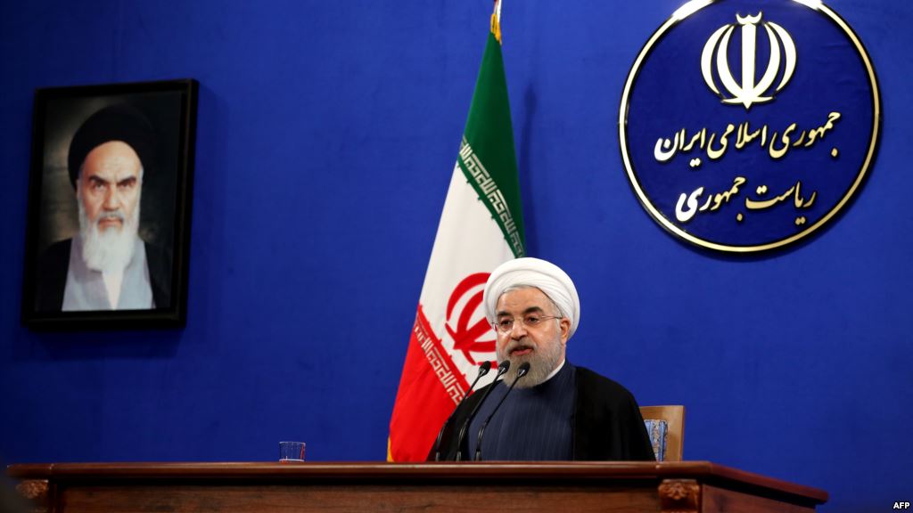 Iranian President Hassan Rohani delivers a speech next to a portrait of the founder of Iran's Islamic republic Ayatollah Ruhollah Khomeini during a press conference in Tehran last month