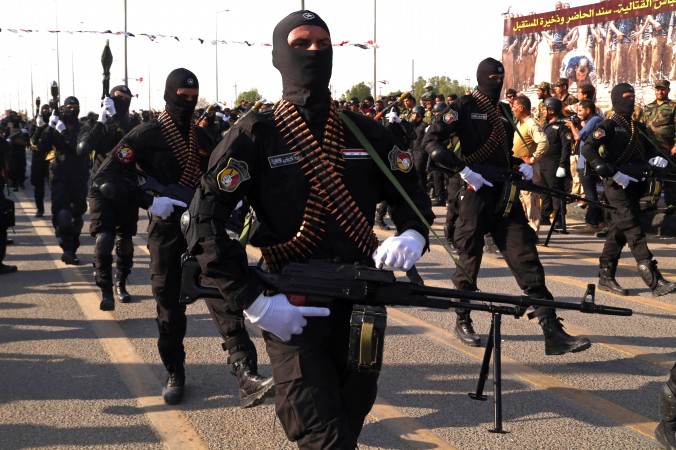 Armed members of the Abbas combat squad a Shiite militia group march in a military parade in Basra 340 miles southeast of Baghdad Iraq Saturday Sept. 26 2015