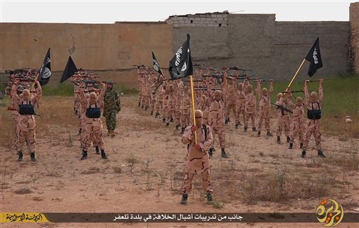 25 2015 by a militant website which has been verified and is consistent with other AP reporting young boys known as the'lion cubs hold rifles and Islamic State group flags as they exercise at a training camp